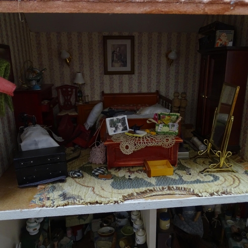 224 - A 1940s style doll's house and garden, 2 floors with fitted interior and associated garden scene, in... 