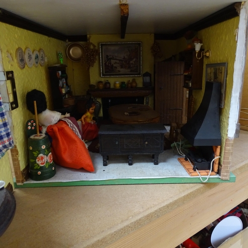 227 - A Tudor style doll's house, over 2 floors, with partially removeable roof, fitted interior, includes... 