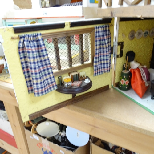 227 - A Tudor style doll's house, over 2 floors, with partially removeable roof, fitted interior, includes... 