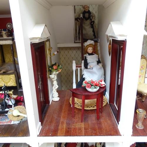 228 - A Regency style doll's house, titled Harbour Wynd, over 3 floors with fitted interior, includes vari... 