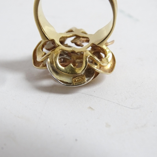 1194 - A stylised 18ct gold flowerhead design dress ring, size K, 8.1g