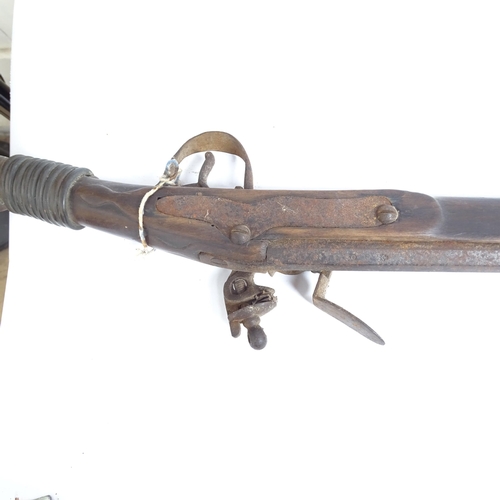 336 - A flintlock rifle, length 157cm