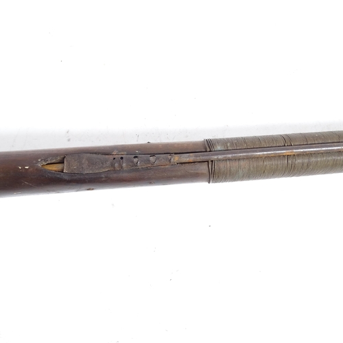 336 - A flintlock rifle, length 157cm