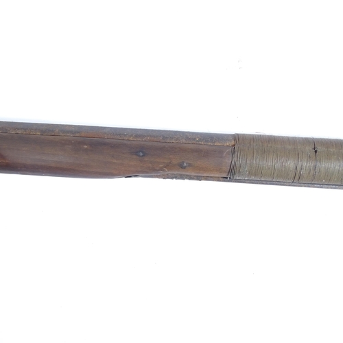 336 - A flintlock rifle, length 157cm