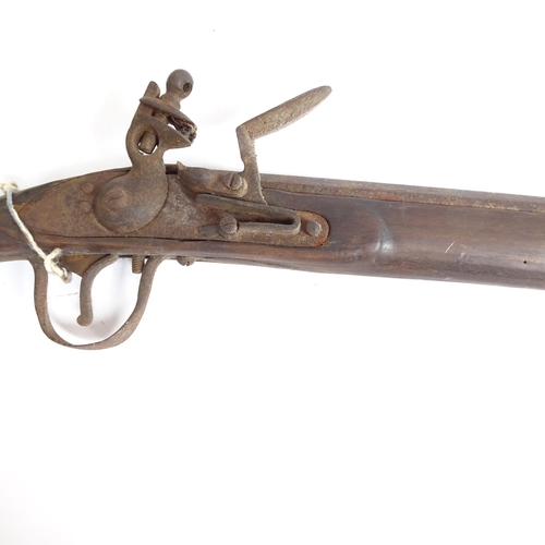 336 - A flintlock rifle, length 157cm