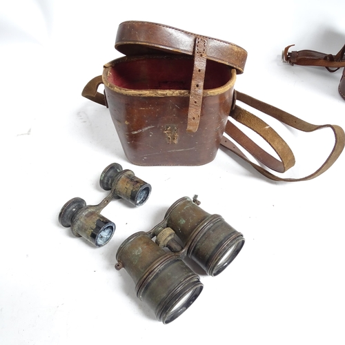 487 - A quantity of Vintage binoculars and associated cases, mostly in A/F condition, some maker's labels ... 