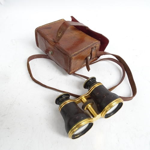 487 - A quantity of Vintage binoculars and associated cases, mostly in A/F condition, some maker's labels ... 