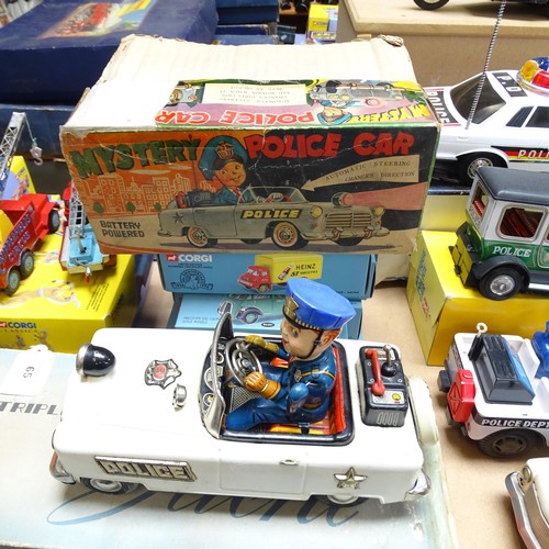 109 - A quantity of Vintage tinplate battery operated Emergency Service vehicles, including a tinplate Pol... 