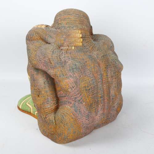 505 - A late 20th century slipcast ceramic ape in green boots, gallery label to base 