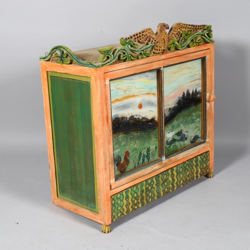 517 - Gerard Rigot (b.1929), France, a wall hanging painted wood/plywood cabinet, with reverse painted gla... 