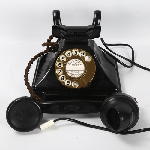 535 - A 1930s' GPO bakelite dial telephone, with number tray in base