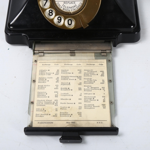 535 - A 1930s' GPO bakelite dial telephone, with number tray in base