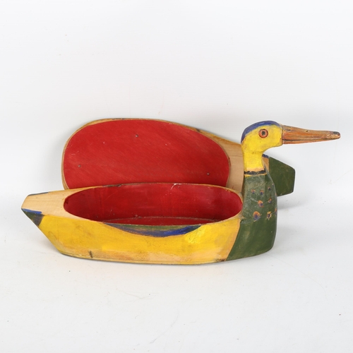 561 - Gerard Rigot (b1929), a wooden hand carved and painted box in duck form, signed to base, length 38cm