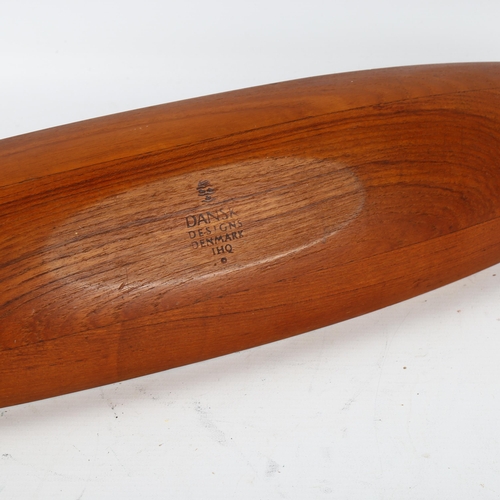 588 - Jens Quistgaard for Dansk Designs, a staved teak longboat styled fruit bowl, 1960s' design, branded ... 