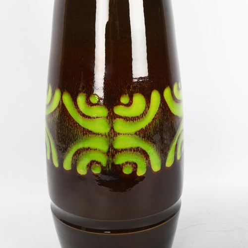 605 - A hand-thrown 1960/70s' Poole Pottery vase with green brush glaze pattern over brown glaze, height 4... 