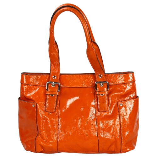 281 - Jaeger Burnt Orange patent leather handbag with dust bag, length approx 35cm