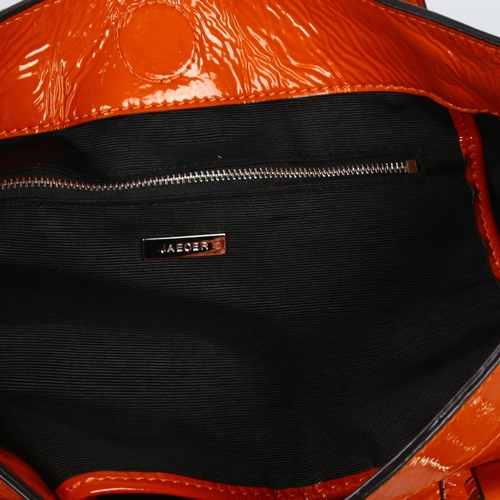 281 - Jaeger Burnt Orange patent leather handbag with dust bag, length approx 35cm