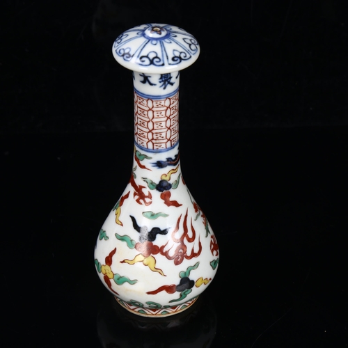 295 - A Chinese porcelain handle with painted sea dragon design, length 14cm