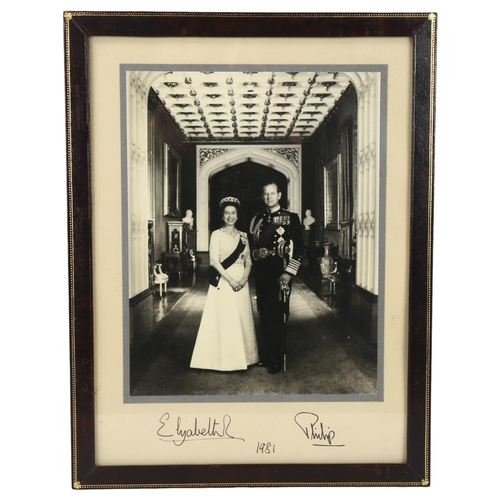 302 - An original signed photograph of HM Queen Elizabeth II and Prince Philip, original ink signatures da... 