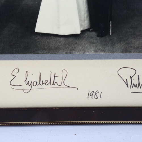 302 - An original signed photograph of HM Queen Elizabeth II and Prince Philip, original ink signatures da... 