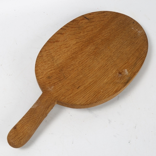 304 - Robert Mouseman Thompson, oak cheese board with carved mouse design handle, length 40cm