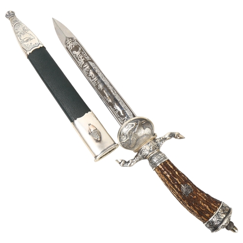 313 - A German Eickhorn Solingen hunting knife, the blade etched with a stag hunting scene, deer's hoof de... 