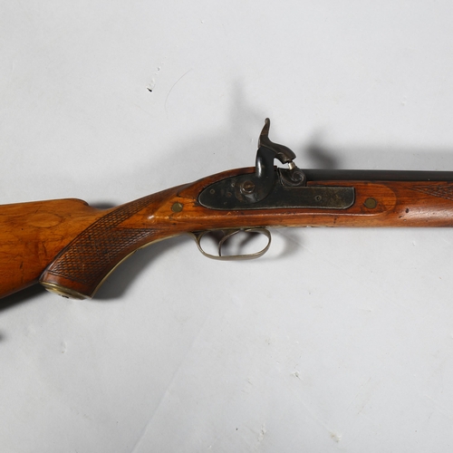 321 - A 19th century percussion rifle with octagonal barrel, barrel length 82cm