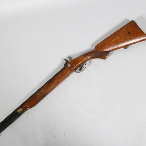 321 - A 19th century percussion rifle with octagonal barrel, barrel length 82cm