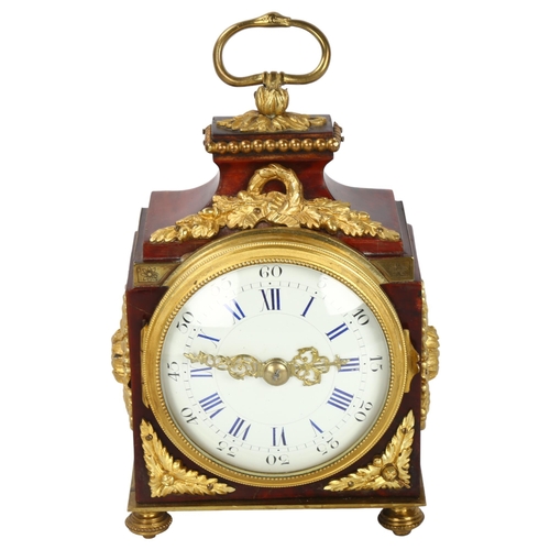 323 - A 19th century tortoiseshell and ormolu-mounted travelling clock, with enamel dial and 8-day movemen... 