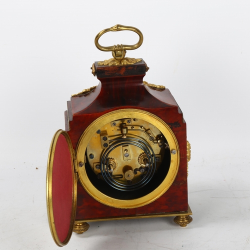 323 - A 19th century tortoiseshell and ormolu-mounted travelling clock, with enamel dial and 8-day movemen... 