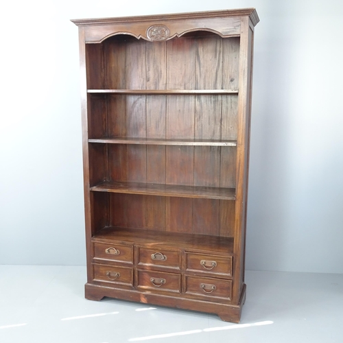 2069 - A tall mahogany open bookcase with three fixed shelves and six drawers below. 124x189x37cm