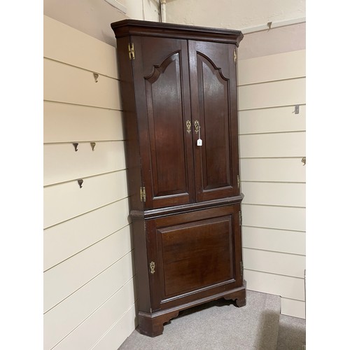 267 - A late 18th century oak, 2-section, corner cupboard, H 212cm, W 100cm, D 55cm