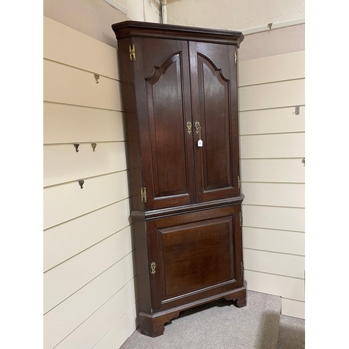 267 - A late 18th century oak, 2-section, corner cupboard, H 212cm, W 100cm, D 55cm