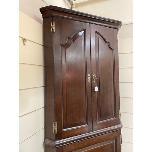 267 - A late 18th century oak, 2-section, corner cupboard, H 212cm, W 100cm, D 55cm