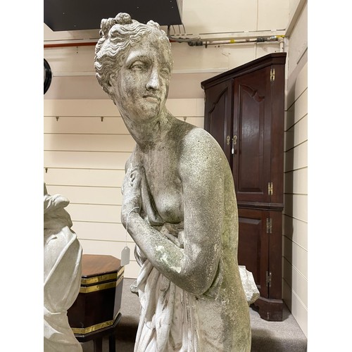 275 - A weathered concrete life-size garden statue of Pandora, on square column base, figure height 175cm,... 