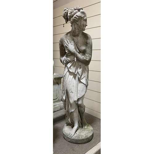 275 - A weathered concrete life-size garden statue of Pandora, on square column base, figure height 175cm,... 