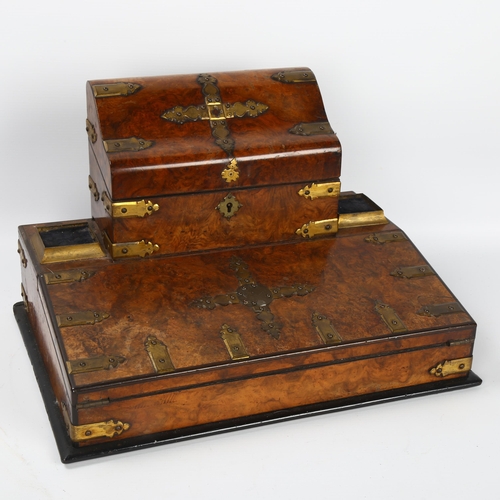 10 - A Victorian burr-walnut desk stand, with hinged stationery compartment above, and gilt-brass strapwo... 