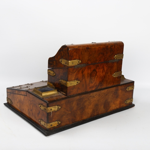 10 - A Victorian burr-walnut desk stand, with hinged stationery compartment above, and gilt-brass strapwo... 