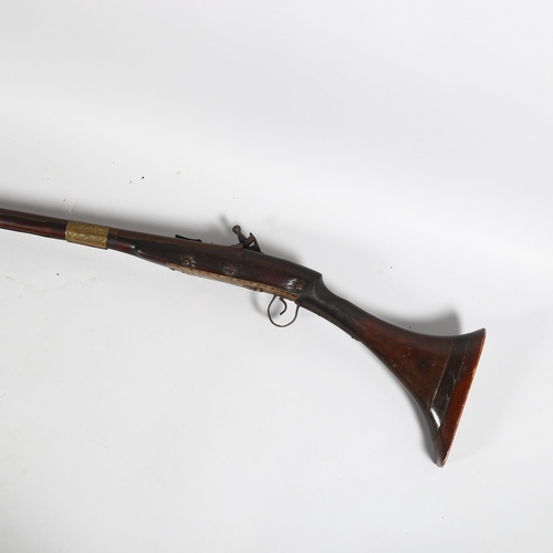 105 - An 18th century Afghan flintlock camel rifle, length 157cm