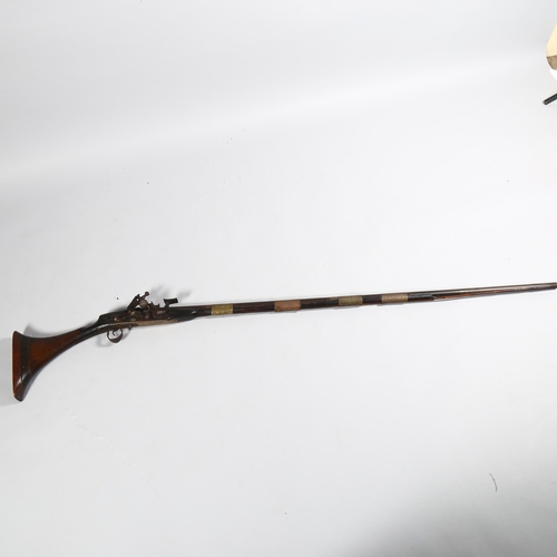 105 - An 18th century Afghan flintlock camel rifle, length 157cm