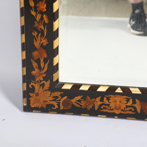 107 - A 19th century marquetry mirror, with inlaid ebony, bevelled glass and an inlaid image of the Green ... 