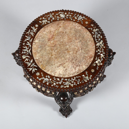 12 - A 19th century Chinese hardwood and mother-of-pearl inlaid circular table, with inset marble top, ca... 