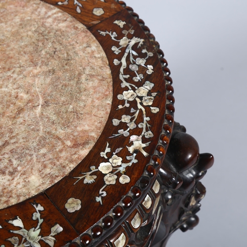 12 - A 19th century Chinese hardwood and mother-of-pearl inlaid circular table, with inset marble top, ca... 