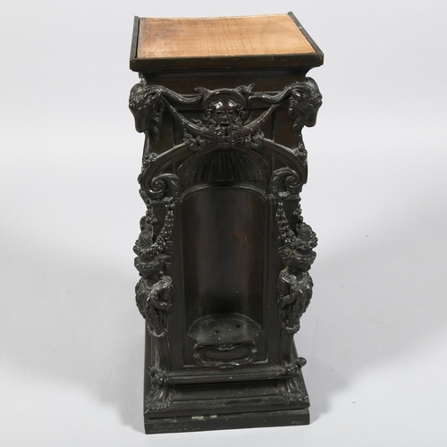 13 - A 19th century relief cast-bronze square section pedestal, with alcove sides and Classical figures a... 