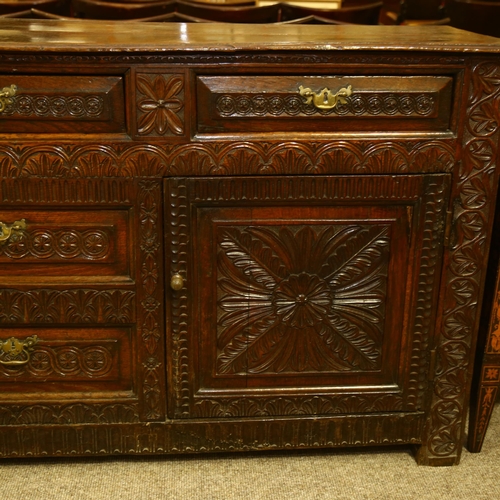 14 - An 18th century oak dresser base, 3 carved frieze drawers with central dummy drawers below flanked b... 