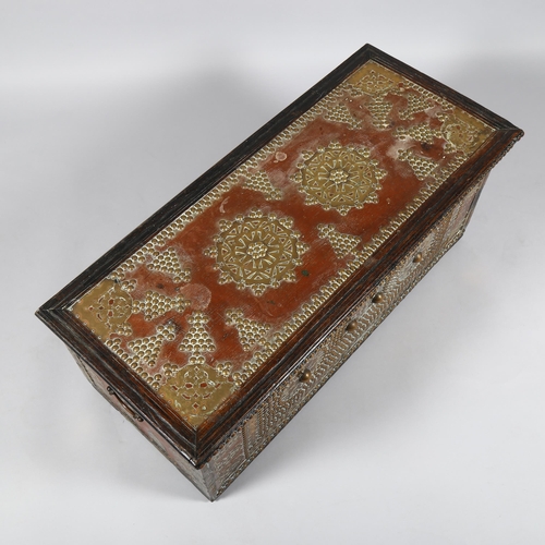 15 - 18th century Continental hardwood chest, with allover brass-studded decoration and applied pierced b... 