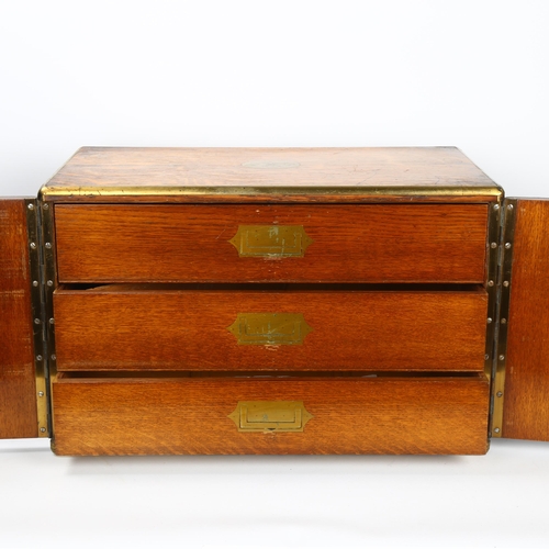 19 - A Victorian brass-bound oak cabinet, with 2 front doors enclosing 3 inner drawers, width 47cm, depth... 