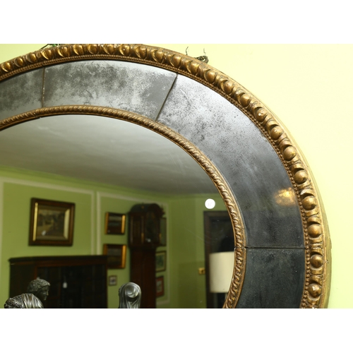22 - A large oval gilt-framed wall mirror, with inset oxidised mirrored surround, overall measurements 13... 