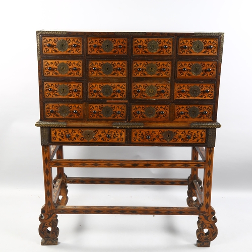 36 - An Indo-Portuguese cabinet on stand (Contador), late 17th century, possibly Old Goa, brass-bound exo... 