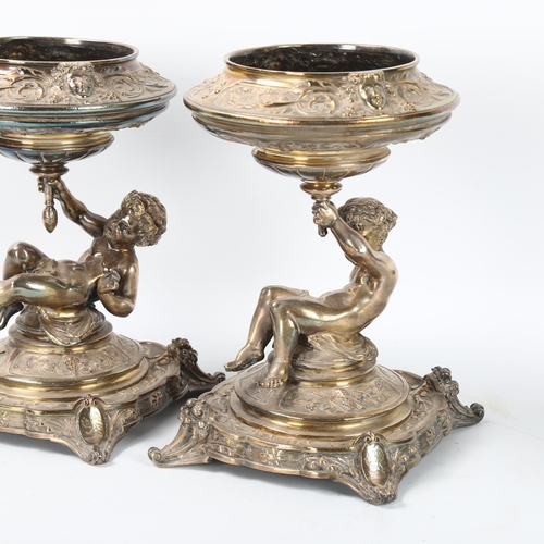 39 - ELKINGTON & CO - a pair of 19th century silver plate table centres, circa 1883, Bacchanalian putti s... 